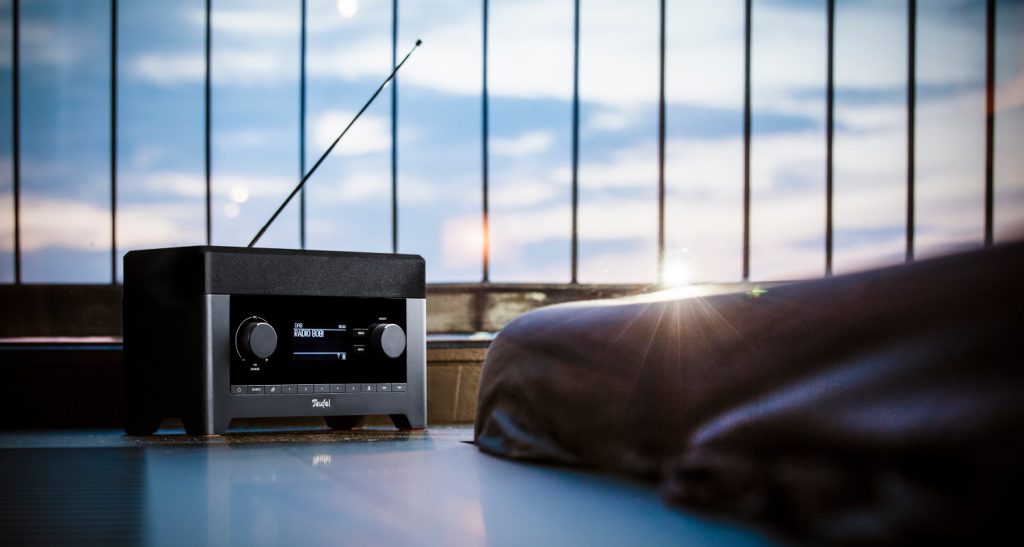 Earworm slayer! The Teufel Radio 3Sixty placed on the floor in the rays of a bright sun playing catchy songs.